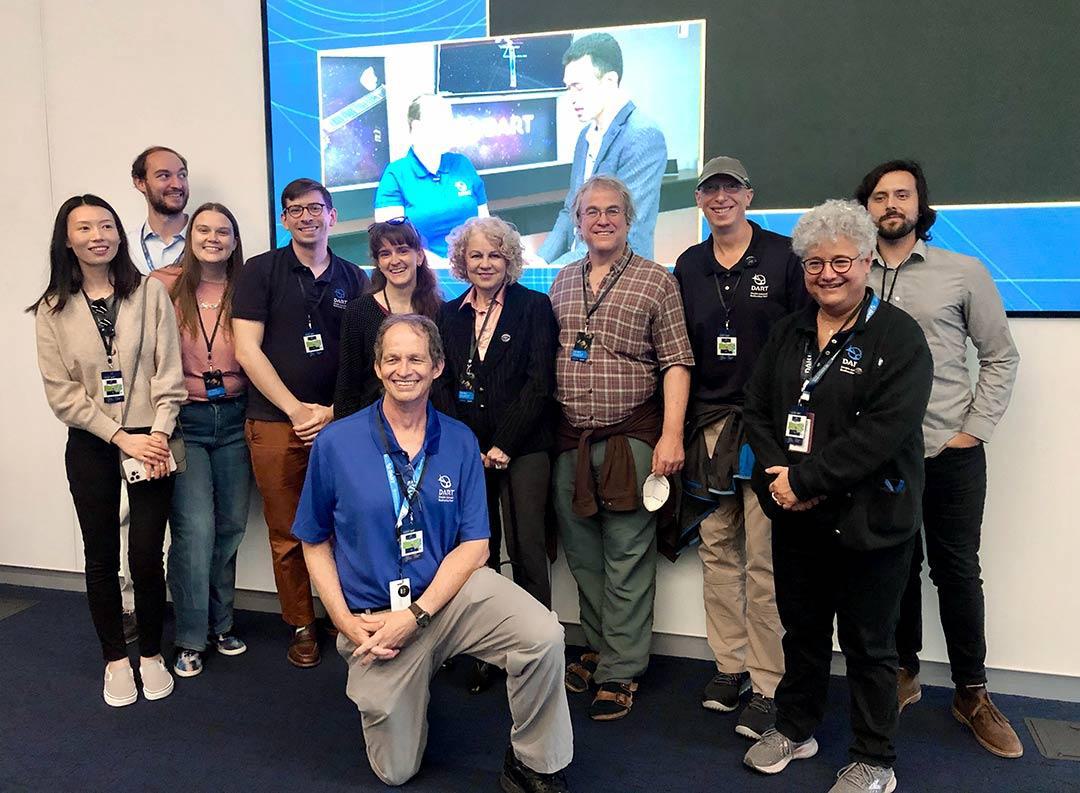 UMD students, faculty and staff who watched the DART impact at Johns Hopkins Applied Physics Laboratory on Monday included (from left) Yun Zhang, Joe DeMartini, Carrie Holt, Harrison Agrusa, Christine Hartzell, Tony Farnham (kneeling), Ludmilla Kolokolova, Doug Hamilton, Derek Richardson, Jessica Sunshine and Julian Marohnic.